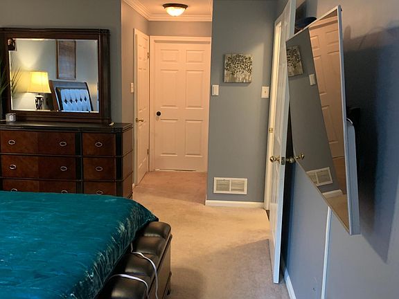 King Size bed along with furniture & there is still plenty of room in this bedroom!