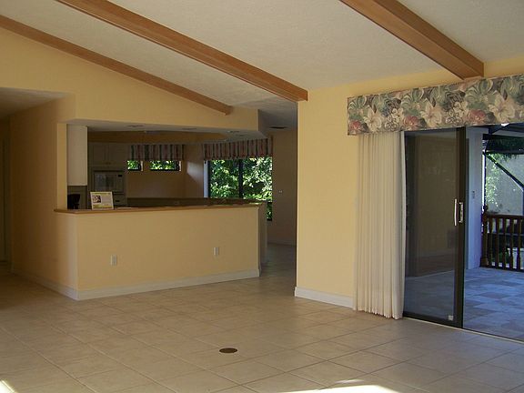 Great room open to kitchen, 2 dining area and office.