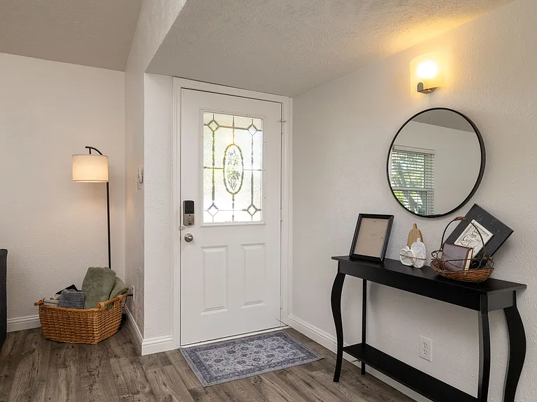 Bright and welcoming entryway to greet you as you arrive _ complete with a smart lock for easy self check-in and safety.