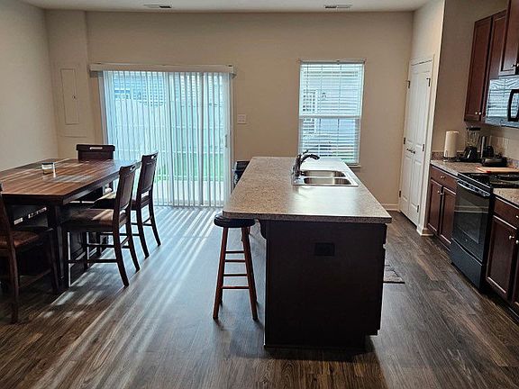 Large kitchen and dining area with natural lighting