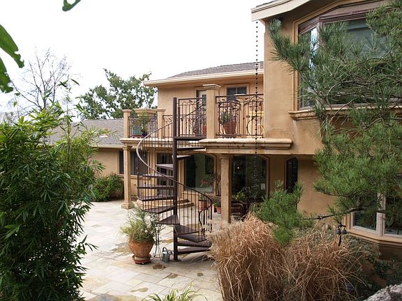 back yard and deck with spiral staircase