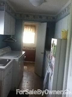Laundry Room
						:
						Large w/lots of cabinets, sink, and full bath off the laundry room.