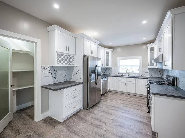 View of kitchen with walk-in pantry on the Left