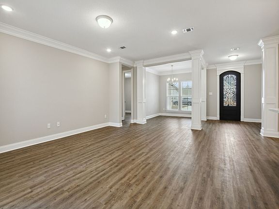 Great room in the Brooks floorplan at a Meritage Homes community in Gulfport, MS.