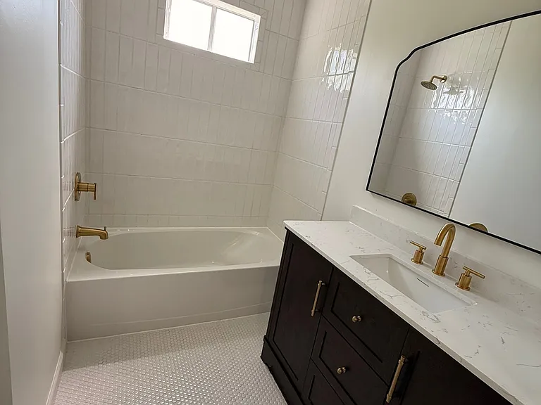 Newly renovated bathroom with marble vanity top.