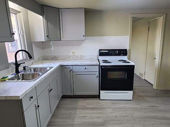 Nice kitchen includes stove and refrigerator, plenty of counter space.