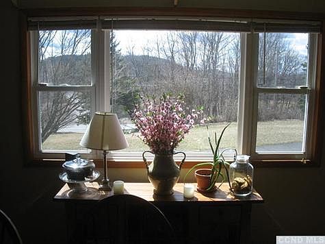 Picture window looking out on countryside.