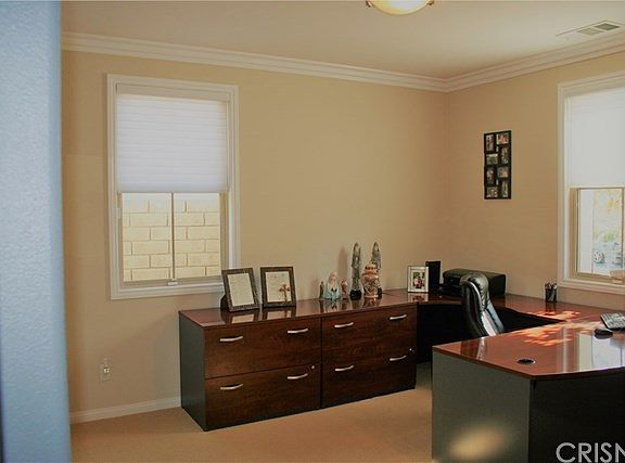 The office/den is to the right of the entry.