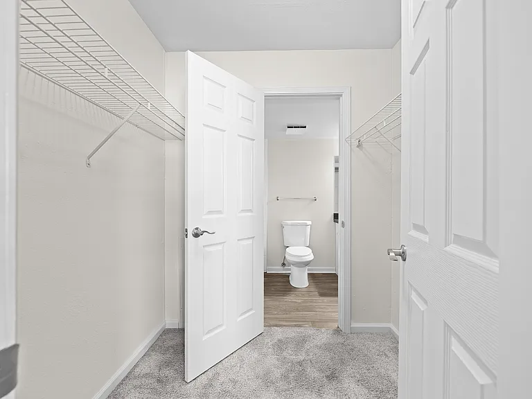 Bathroom with walk in closet at Three Oaks Apartments, Troy, Michigan