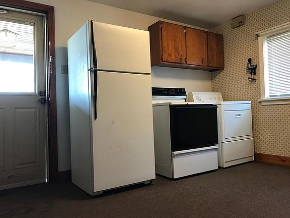 Kitchen with washer and dryer in unit