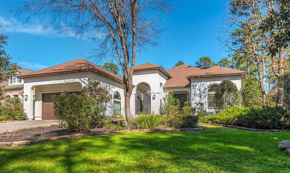 Stunning Meyer-Leigh custom home in coveted Southern Garden neighborhood of Sterling Ridge. Outstanding curb appeal with custom landscaping and double metal doors leading to front courtyard with pool. RARE 2 BEDROOMS DOWN! Spacious backyard with larg