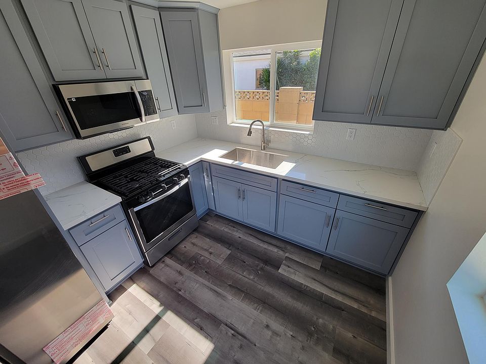 Kitchen. Quartz counter tops and custom cabinets. Motion sensor Ed faucet! Brand new refrigerator and over the range microwave.