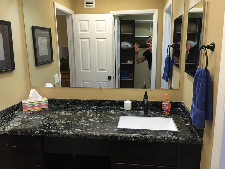 master bathroom with granite counter tops and large vanity