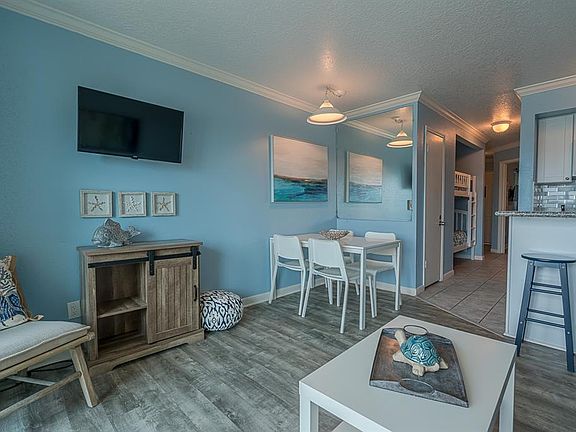 2 wall-mounted tvs and beach decor for your weekend getaway!