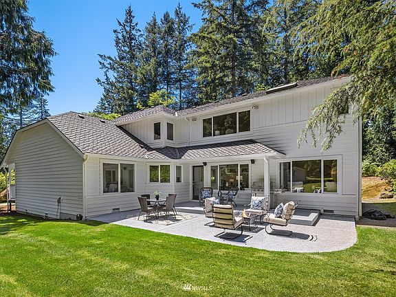 Beautiful patio overlooking a level, private, shy acre yard.