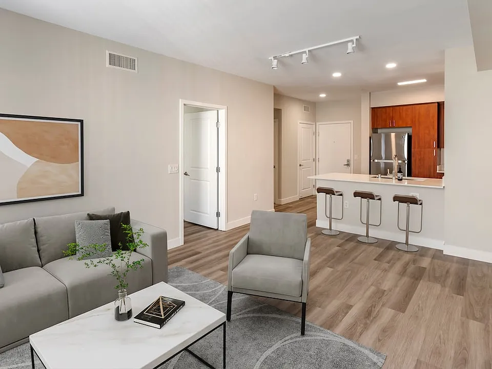 Renovated Package I kitchen, living and dining areas with hard surface flooring