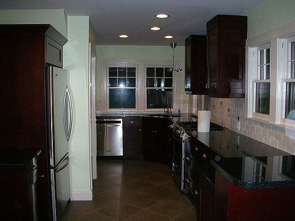 New custom kitchen with stainless steel appliances and heated floor