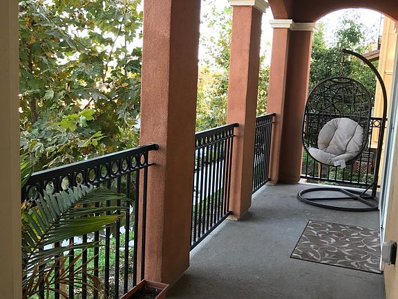 Balcony pointing to open area. No neighbors. Nice view outside.