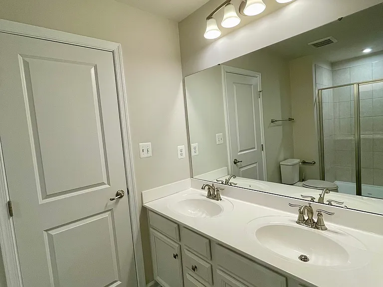 Private bath with dual vanity and spacious walk-in closet