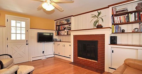 Family Room with Built-In Bookcases and Wood-Burning Fireplace