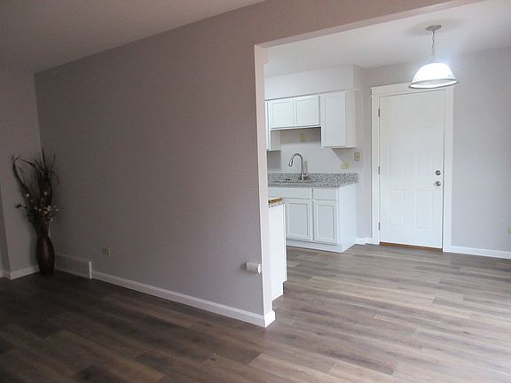 From the living room you go to the eat in area of the kitchen.  Plenty of room for the table to be e