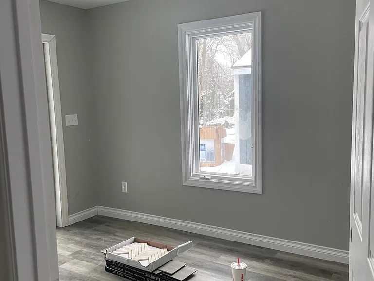 Bedroom with sliding glass door for access to the back yard