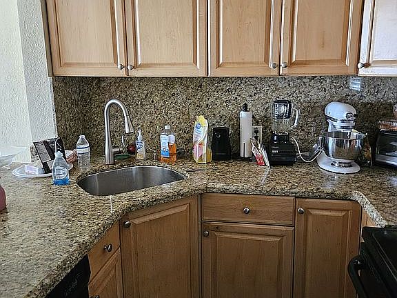 open kitchen with granite co