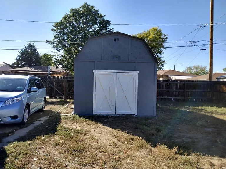 large storage shed and back yard parking