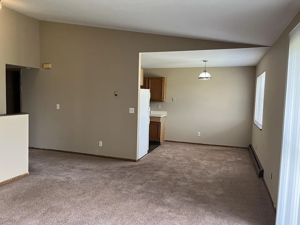 Living room looking into dining room and kitchen