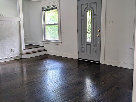 Living room and stairway leading upstairs.
