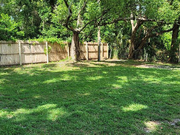 Beautiful fenced wooded back yard!