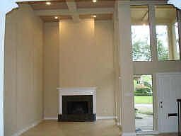 TILE FLOORS THOUGHOUT THE FIRST FLOOR WITH TWO STORY LIVING ROOM