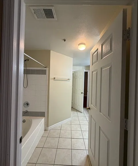From the entryway, walk past the bathroom 1 to reach the bedroom 1, an ideal layout for shared living.