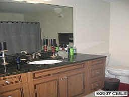 Spacious main bathroom with granite counters