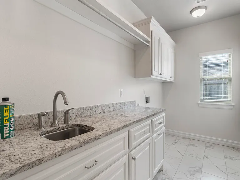 Laundry room with hook ups and lots of storage