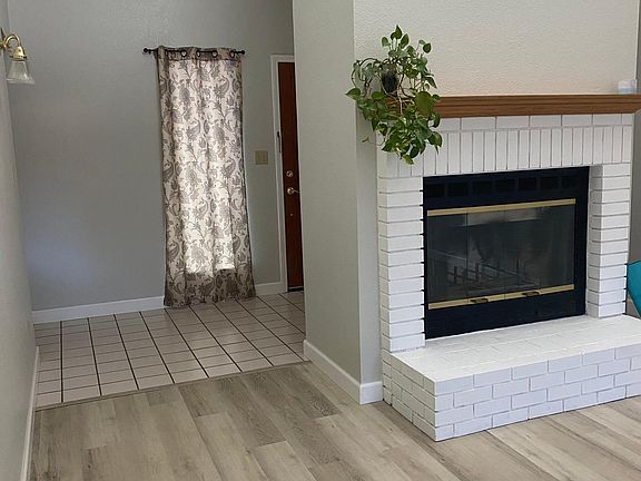 facing entrance with view of fireplace