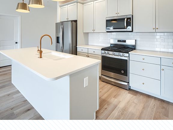 Spacious Kitchen with Upgraded Counter Tops, Refrigerator, Stove, Microwave and Cabinets