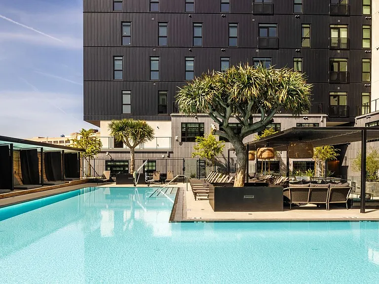 Pool and sundeck with cabanas