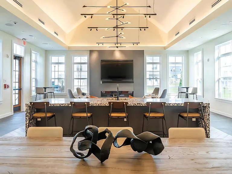 Spacious Clubhouse Featuring High Ceilings and Lounge Furniture