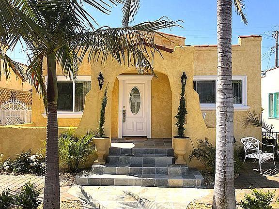 Photo of home entrance including a front patio to the left.