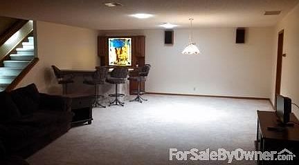 Family room/entertaining
						:
						Wet Bar. Area for pool table or card table. Beautiful Carpet.