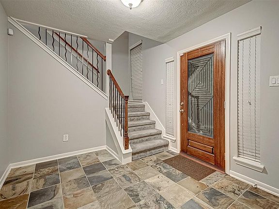 First Floor Entry Way /Laundry Room and Access To Garage