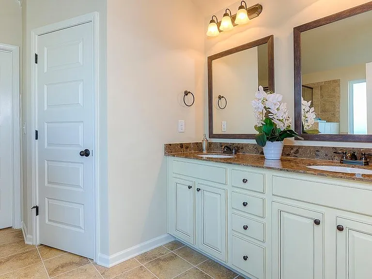 Great Room Bathroom ( Actual House has Cabinet stain)