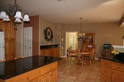 Kitchen with granite countertops & center island
