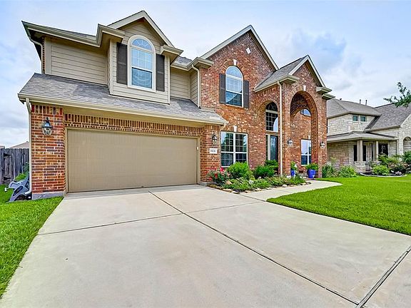 Beautiful brick home with nice coach lights.