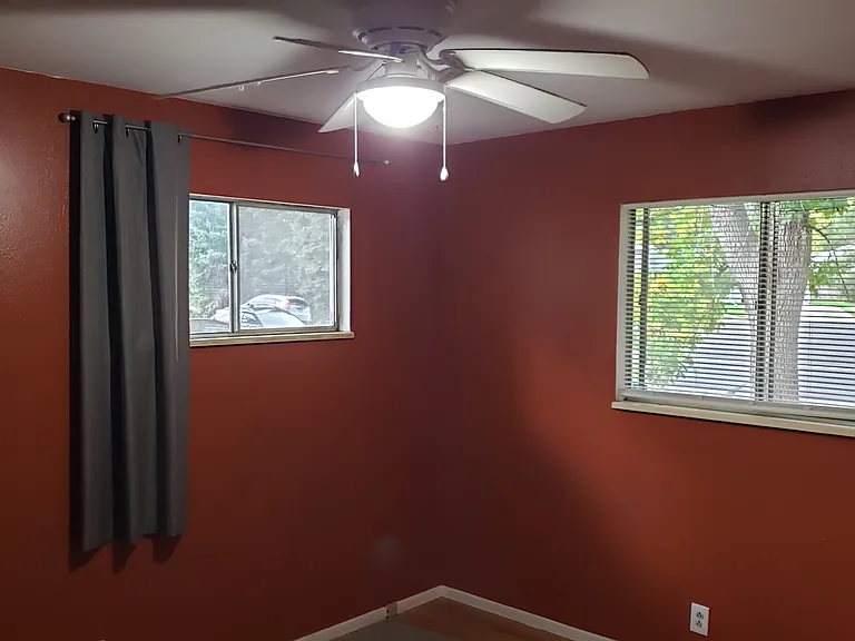 SW Bedroom- windows face South & West. Each BR has hardwood floors & closet.