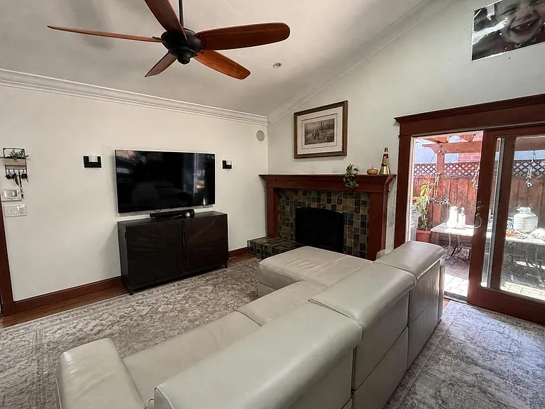 Family room with gas fireplace, entrance to side yard and garage.