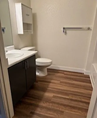 Full bathroom with vanity and storage