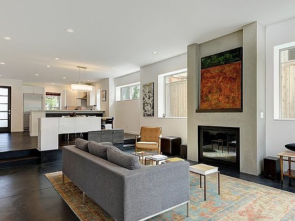 Main level gas fireplace with hand finished plaster surround and wiring for flat screen TV.