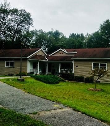 There are 13 buildings, each containing 3 apartments with a 